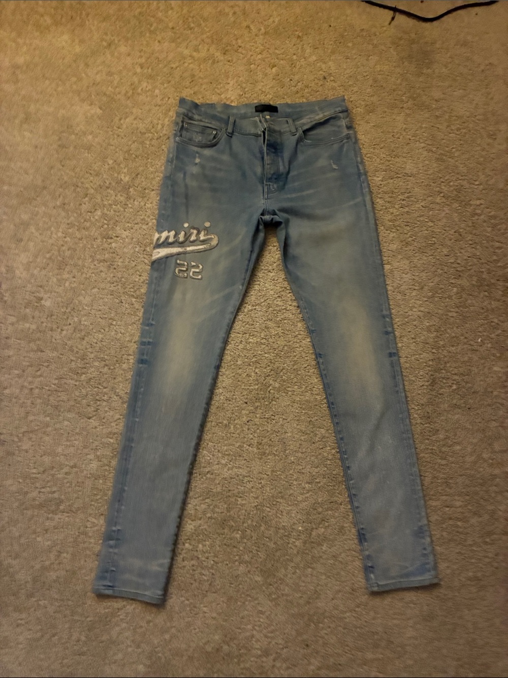 AMIRI Light Blue Skinny Jeans with Script Thigh Detail